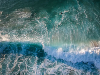 High angle view of water splashing in sea
