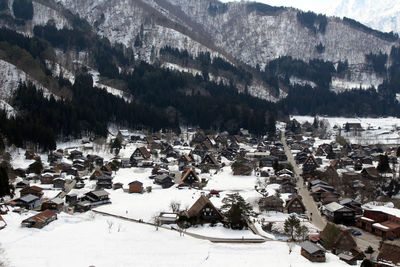 High angle view of snow covered land and mountains