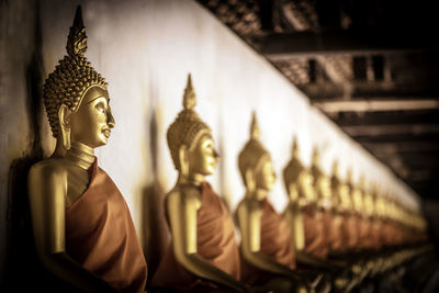 Statue of buddha against building