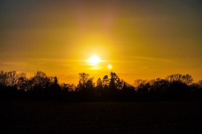 Scenic view of silhouette trees against sky during sunset