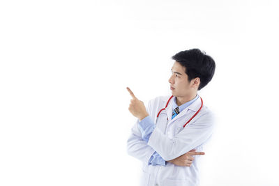 Full length of man standing against white background
