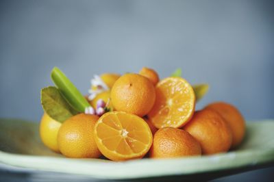 Close-up of rangpur limes on plate