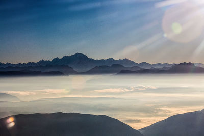 Scenic view of mountains against sky during sunset