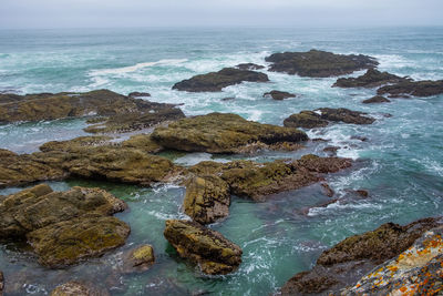 Closeup view of blue tidal pools and small waves