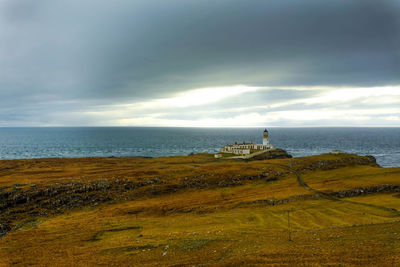 Scenic view of sea against cloudy sky