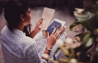 High angle view of woman using mobile phone