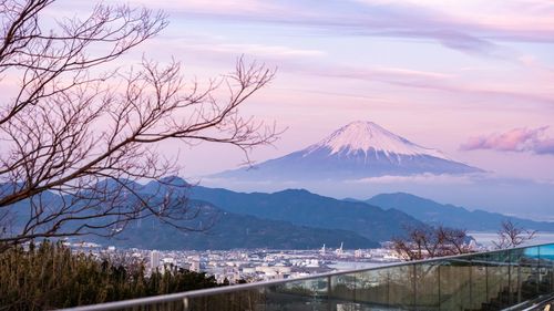 Scenic view of snowcapped mountains against sky during sunset