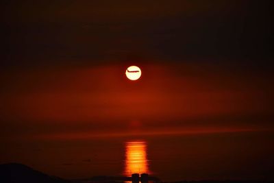 Scenic view of sea against sky at night