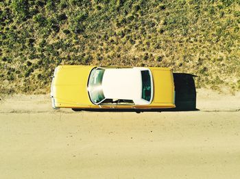 High angle view of vintage car on road during sunny day