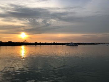Scenic view of lake against sky during sunset