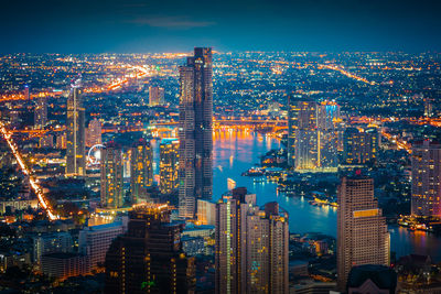 Aerial view of illuminated buildings in city