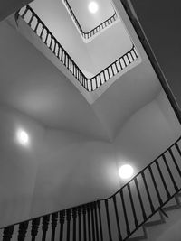 Low angle view of illuminated pendant light in building