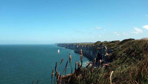 Scenic view of sea against blue sky