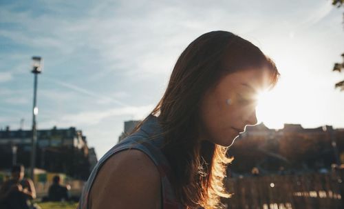 Close-up of woman against blurred background