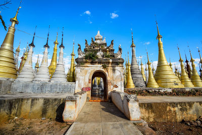 View of temple building against blue sky