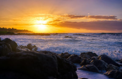 Scenic view of sea against sky during sunset