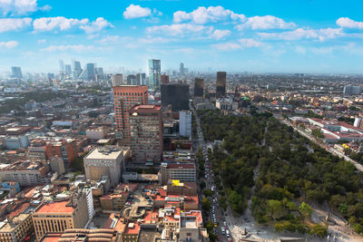 High angle view of buildings in city against sky