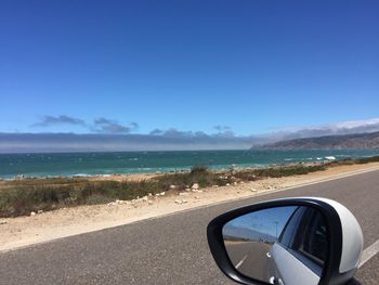 Cropped image of car on road