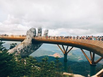 Bridge over lake against sky