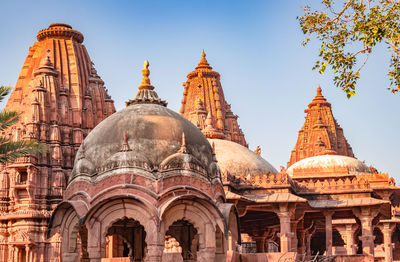 Ancient hindu temple architecture with bright blue sky from unique angle at day