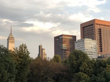 Modern buildings against sky in city