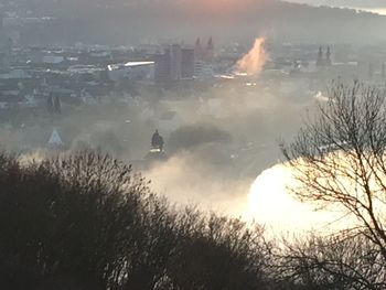 River in city during foggy weather