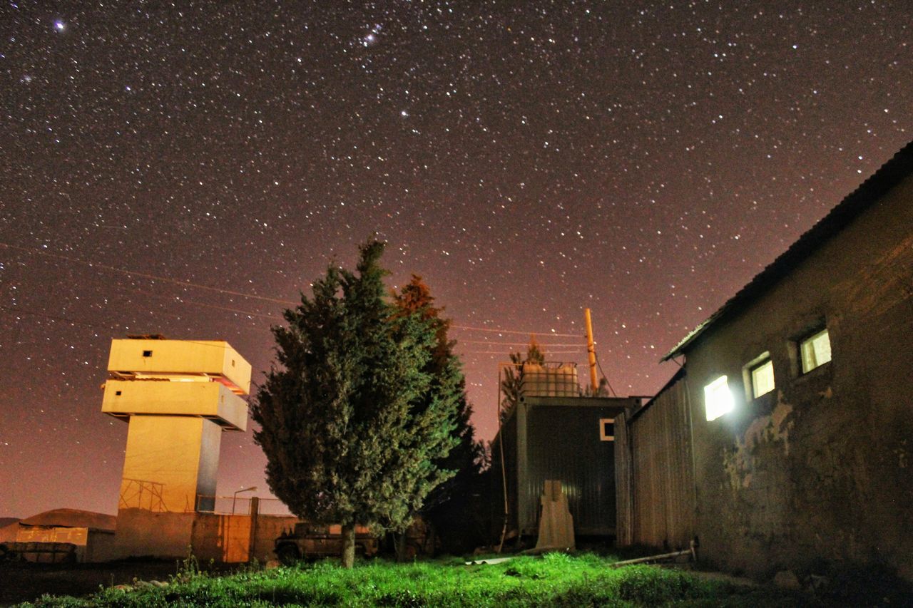 night, star - space, architecture, building exterior, built structure, tree, star field, illuminated, house, sky, low angle view, astronomy, star, galaxy, nature, tranquility, outdoors, beauty in nature, scenics, no people