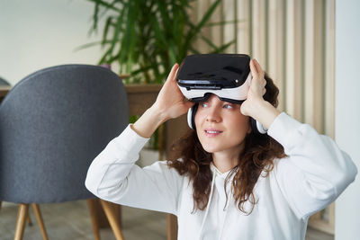 Portrait of young woman using mobile phone