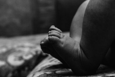 Low section of woman sitting on floor