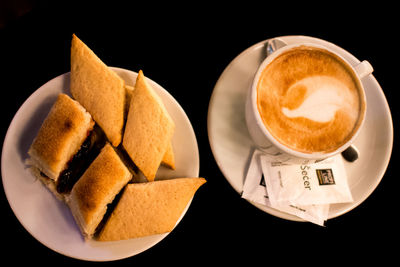 High angle view of cappuccino served on table