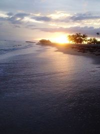 Scenic view of sea at sunset