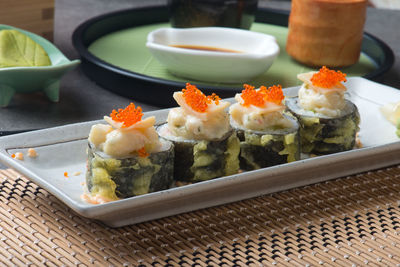 Close-up of sushi served on table