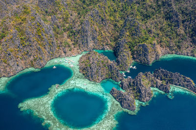 High angle view of rocks on sea shore