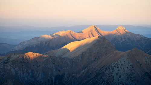 Alpine landscape with mountain ranges, peaks catching last light during sunset, europe, slovakia