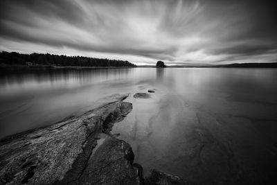 View of lake against cloudy sky