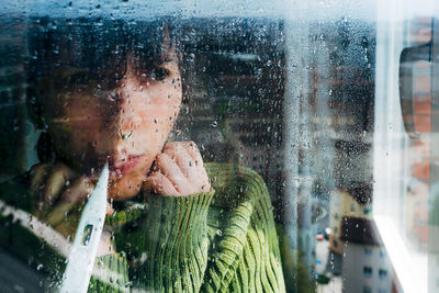 Close-up of wet glass window in rainy season