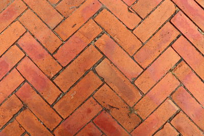 The old diagonal red brick as background or wallpaper