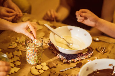 Midsection of woman preparing food on table