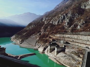 Reflection of mountain in sea against sky