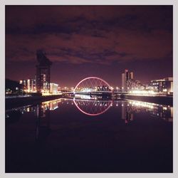 Bridge over river at night