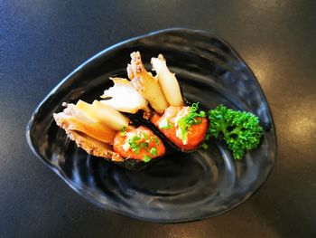 High angle view of fish in plate on table