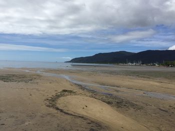 Scenic view of calm sea against cloudy sky