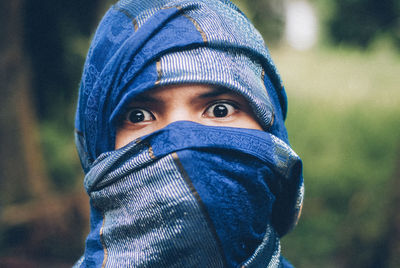 Close-up portrait of man with obscured face