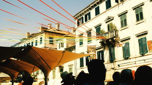 People in city against clear sky