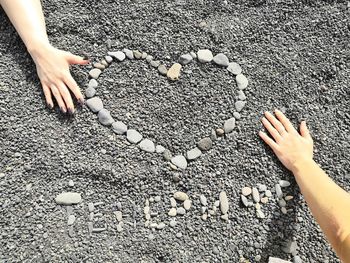 High angle view of hand on sand