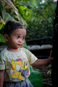 Portrait of cute boy looking away