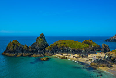 Panoramic view of sea against blue sky