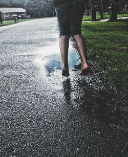 Low section of people walking on footpath