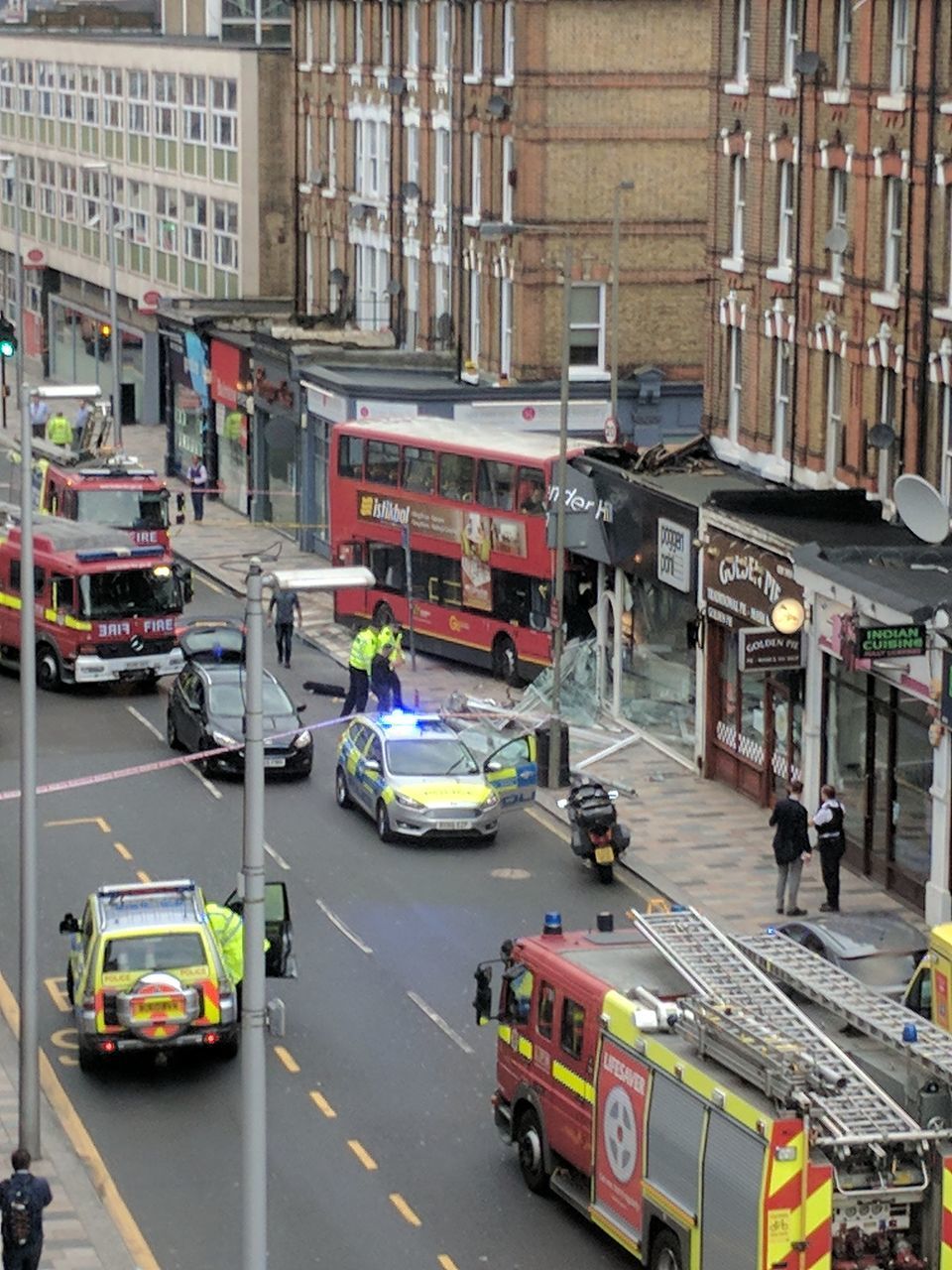 HIGH ANGLE VIEW OF VEHICLES ON ROAD