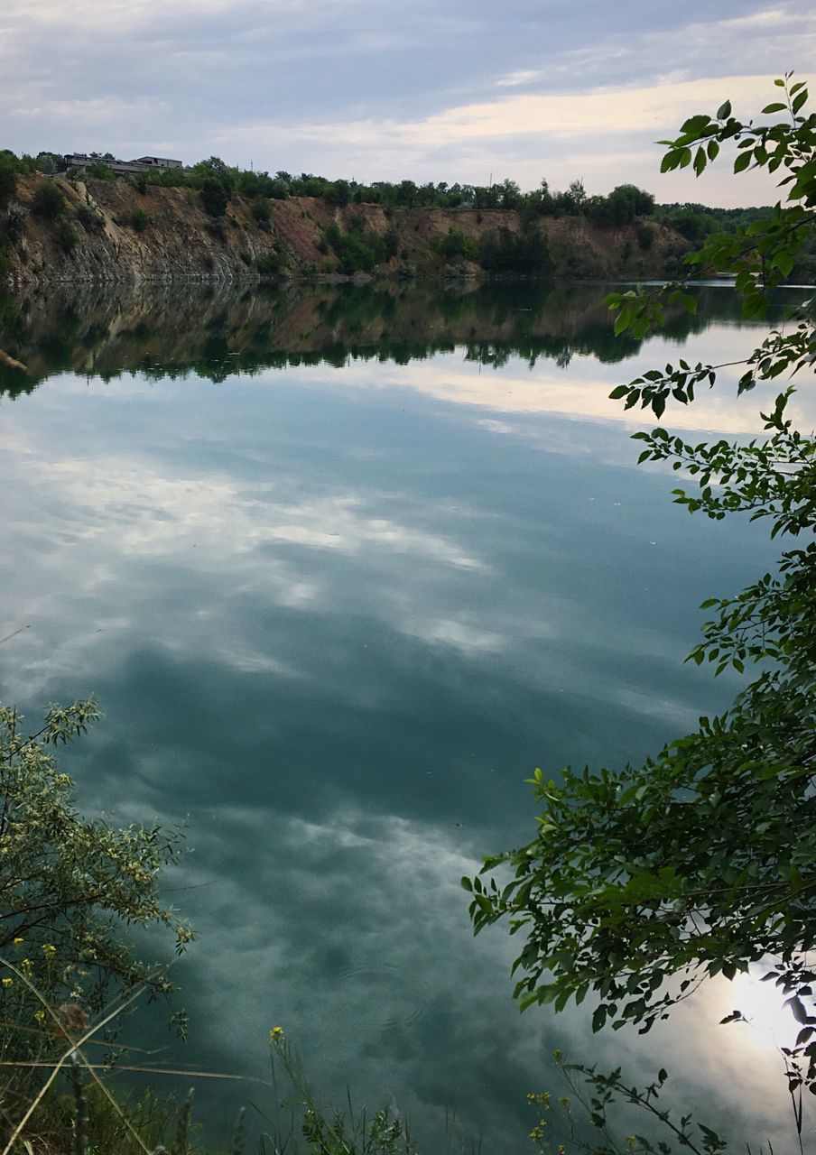 water, reflection, nature, tranquility, beauty in nature, no people, tranquil scene, tree, outdoors, sky, lake, day, scenics, cloud - sky, plant, growth